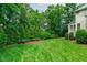 Expansive backyard with lush lawn and mature trees providing privacy at 102 Lions Mouth Ct, Cary, NC 27518