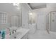 Spacious Primary bathroom with double sinks, a soaking tub, and glass-enclosed shower, providing a luxurious experience at 102 Lions Mouth Ct, Cary, NC 27518