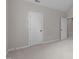 Spacious bedroom with neutral walls, carpet flooring, and a large closet door at 102 Lions Mouth Ct, Cary, NC 27518
