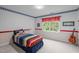 bedroom with colorful decor, a striped comforter, and a window with red curtains at 102 Lions Mouth Ct, Cary, NC 27518