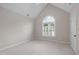 Neutral bedroom with carpet, white trim, and a half-moon window, ready for personalization at 102 Lions Mouth Ct, Cary, NC 27518