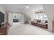 Upstairs bonus room featuring carpet, large windows, and a comfortable seating area with a sofa at 102 Lions Mouth Ct, Cary, NC 27518
