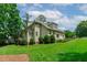Well-maintained exterior with lush lawn, mature trees, and inviting outdoor space at 102 Lions Mouth Ct, Cary, NC 27518