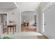 Welcoming foyer with view into a home office or study with natural light at 102 Lions Mouth Ct, Cary, NC 27518