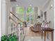 Inviting living room boasting natural light and a staircase at 102 Lions Mouth Ct, Cary, NC 27518