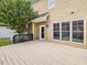 A large deck overlooks the backyard, connecting the home to the outdoors and landscaping at 102 Westside Dr, Chapel Hill, NC 27516