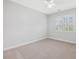 Bedroom with carpet, window, and ceiling fan at 102 Westside Dr, Chapel Hill, NC 27516