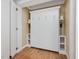 Murphy bed featuring side shelves with reading lamps, and clean white walls with hardwood floors at 102 Westside Dr, Chapel Hill, NC 27516