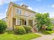 Beautiful two-story home featuring a classic design, large porch and lush green lawn at 102 Westside Dr, Chapel Hill, NC 27516