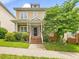 Charming two-story home with a welcoming front porch and well-manicured landscaping at 102 Westside Dr, Chapel Hill, NC 27516