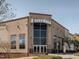 Commercial building with large glass windows and signage, offering modern office or retail space at 102 Westside Dr, Chapel Hill, NC 27516