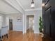 Elegant foyer with hardwood floors, crown molding, and a view into the living spaces at 102 Westside Dr, Chapel Hill, NC 27516