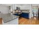 Modern kitchen with stainless steel appliances, granite countertops, and a stylish mosaic backsplash at 102 Westside Dr, Chapel Hill, NC 27516