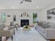 Cozy living room showcasing hardwood floors, a stylish fireplace, and comfortable seating arrangement at 102 Westside Dr, Chapel Hill, NC 27516