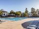 Community swimming pool with ample seating, umbrellas, and clear blue water for residents to enjoy at 102 Westside Dr, Chapel Hill, NC 27516