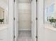 A large walk-in closet offers ample storage space with wire shelving and bright lighting at 102 Westside Dr, Chapel Hill, NC 27516