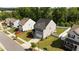 Aerial view of home featuring a fenced backyard and gray siding, next to similar homes at 1028 Gallivant Way, Wake Forest, NC 27587