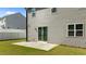 Back exterior with sliding glass doors opening onto a patio and fenced-in yard at 1028 Gallivant Way, Wake Forest, NC 27587