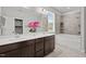 Modern bathroom featuring a dual vanity, and a bathtub and shower combination at 1028 Gallivant Way, Wake Forest, NC 27587
