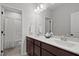 Bathroom features a double sink vanity, large mirror, and separate toilet and shower room at 1028 Gallivant Way, Wake Forest, NC 27587