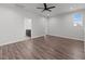 Bedroom with hardwood floors, ensuite bathroom, ceiling fan and natural light at 1028 Gallivant Way, Wake Forest, NC 27587