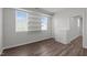 Bedroom features shelving, bright natural light, light colored walls and wood floor at 1028 Gallivant Way, Wake Forest, NC 27587