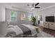 Bedroom showcasing natural light, wood floors, and access to an ensuite bathroom at 1028 Gallivant Way, Wake Forest, NC 27587