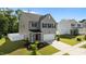 The front exterior of a two-story home with a two-car garage and manicured lawn at 1028 Gallivant Way, Wake Forest, NC 27587