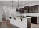 Open-concept kitchen with a granite island, ample cabinet space, and modern finishes at 1028 Gallivant Way, Wake Forest, NC 27587