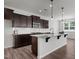Contemporary kitchen featuring granite countertops, subway tile backsplash and pendant lights at 1028 Gallivant Way, Wake Forest, NC 27587