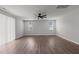 Large living room features a fan, recessed lights, light colored walls and wood floor at 1028 Gallivant Way, Wake Forest, NC 27587