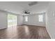 Spacious living room with a ceiling fan, recessed lighting, three windows and sliding glass door at 1028 Gallivant Way, Wake Forest, NC 27587