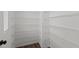 Spacious pantry with multiple rows of white wire shelving, overhead light and wood floor at 1028 Gallivant Way, Wake Forest, NC 27587