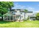 Beautiful backyard showcasing a well-maintained lawn, patio, and outdoor seating area at 103 Chapelwood Way, Cary, NC 27518