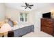 Cozy bedroom with a comfortable bed, ample storage, and a window with a view at 103 Chapelwood Way, Cary, NC 27518