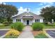Attractive community clubhouse with manicured landscaping, and ample parking at 103 Chapelwood Way, Cary, NC 27518