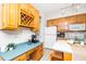 A kitchen with a breakfast bar, ample counter space, wooden cabinets, and modern appliances at 103 Chapelwood Way, Cary, NC 27518