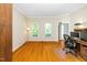 A home office features hardwood floors, natural light, and an organized workspace at 103 Chapelwood Way, Cary, NC 27518