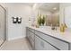 Modern bathroom with double vanity, quartz countertops, and a sleek glass-enclosed shower at 10518 Pleasant Branch Dr # 33, Raleigh, NC 27614