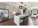 Modern kitchen with stainless steel appliances, quartz countertops, and an island with bar seating at 10518 Pleasant Branch Dr # 33, Raleigh, NC 27614