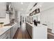 Bright, open kitchen featuring stainless steel appliances, light gray cabinets, and an island with pendant lighting at 10518 Pleasant Branch Dr # 33, Raleigh, NC 27614