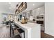 Modern kitchen with large island, stainless steel appliances, and seating for four, perfect for entertaining at 10518 Pleasant Branch Dr # 33, Raleigh, NC 27614