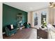 Cozy den features unique shelving, comfortable armchairs and french doors to the outside at 10518 Pleasant Branch Dr # 33, Raleigh, NC 27614