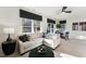 Inviting living space with a comfortable couch, large windows, and modern decor accents at 10518 Pleasant Branch Dr # 33, Raleigh, NC 27614
