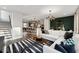 Bright, open-concept living room with modern decor, flowing seamlessly into the kitchen and dining area at 10518 Pleasant Branch Dr # 33, Raleigh, NC 27614