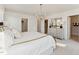 Comfortable main bedroom featuring a plush bed, soft lighting, and an organized closet at 10518 Pleasant Branch Dr # 33, Raleigh, NC 27614