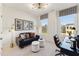 Functional home office space featuring a comfortable sofa and a modern work desk area at 10518 Pleasant Branch Dr # 33, Raleigh, NC 27614