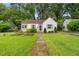 Charming home with a well-manicured lawn and inviting front yard landscaping at 109 Davidson Ave, Durham, NC 27704