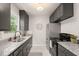Modern kitchen featuring granite countertops and stainless steel appliances at 109 Davidson Ave, Durham, NC 27704