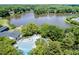Aerial view showcasing a community pool, lake access, and the surrounding neighborhood at 113 Spring Cove Dr, Cary, NC 27511